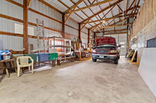 Outbuilding facing south with 12' overhead door.