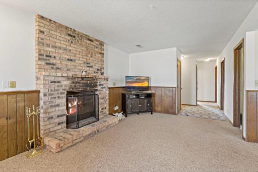 Lower-level family room with Chicago-brick wood-burning fireplace.
