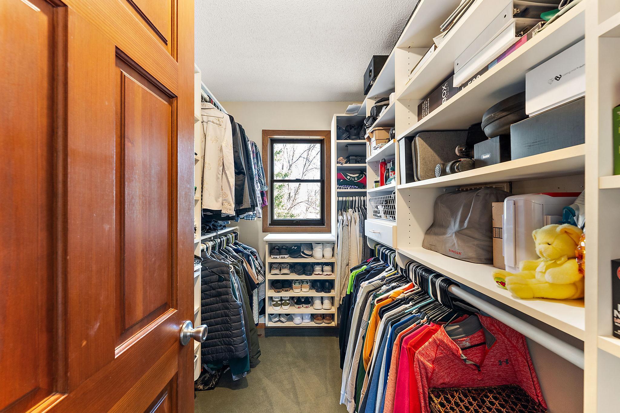California closets in the primary walk in closet