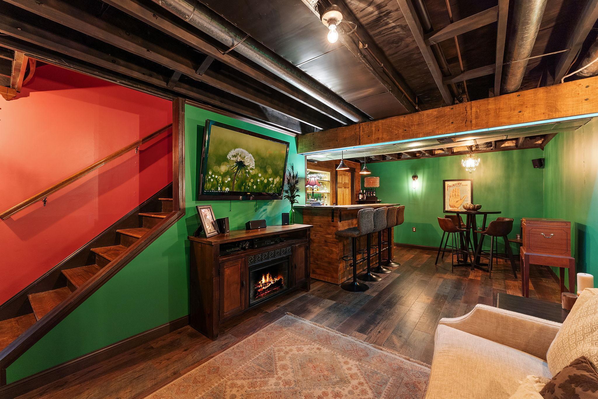 The lower level family room doubles as a speakeasy
