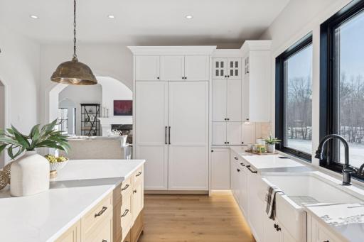 Gourmet kitchen showcasing premium appliances, built-in refrigeration, and thoughtfully designed cabinetry for both beauty and function.