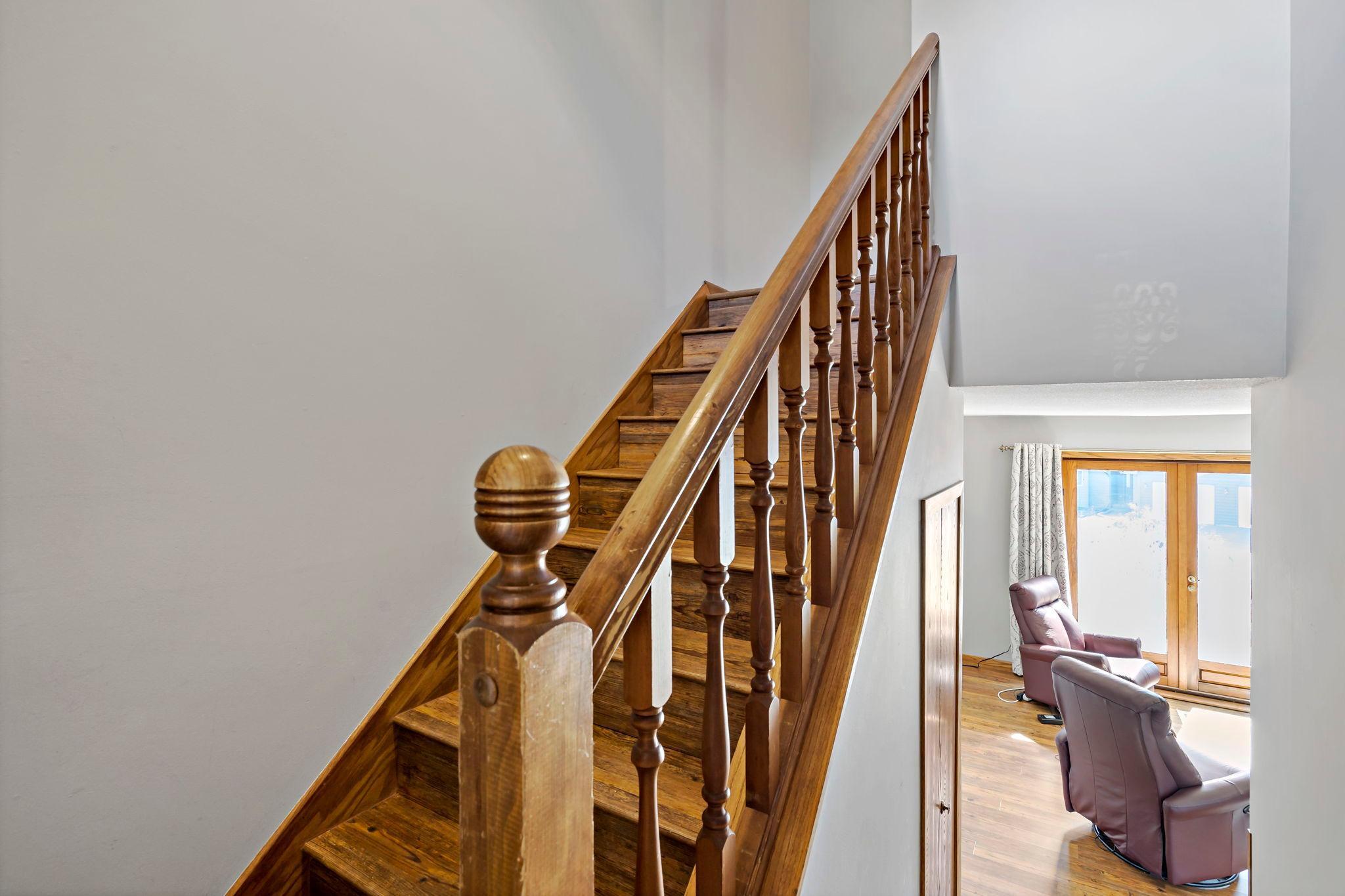 Split-entry layout with bedrooms up and main living spaces down