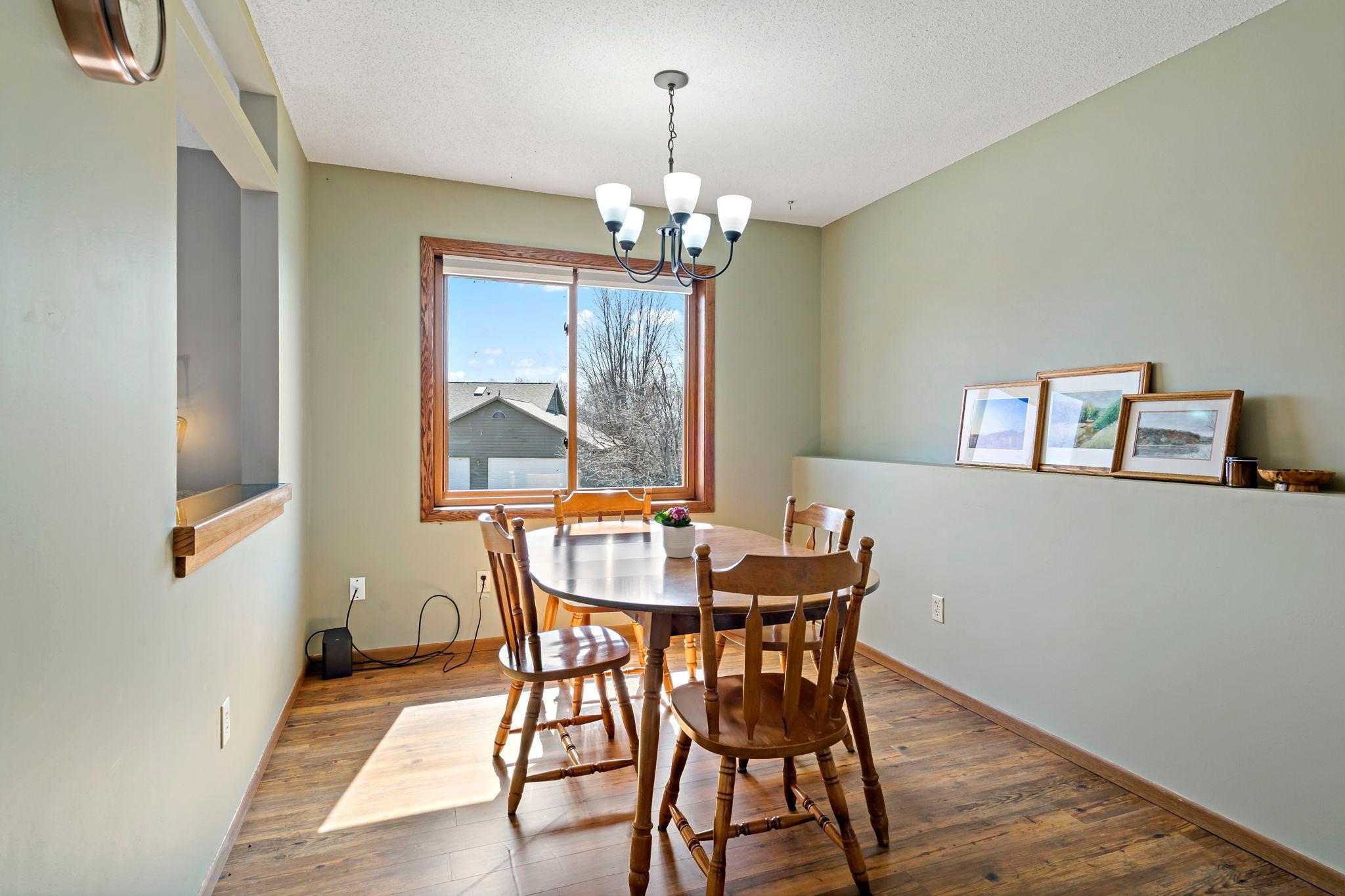 Cozy dining area overlooking backyard