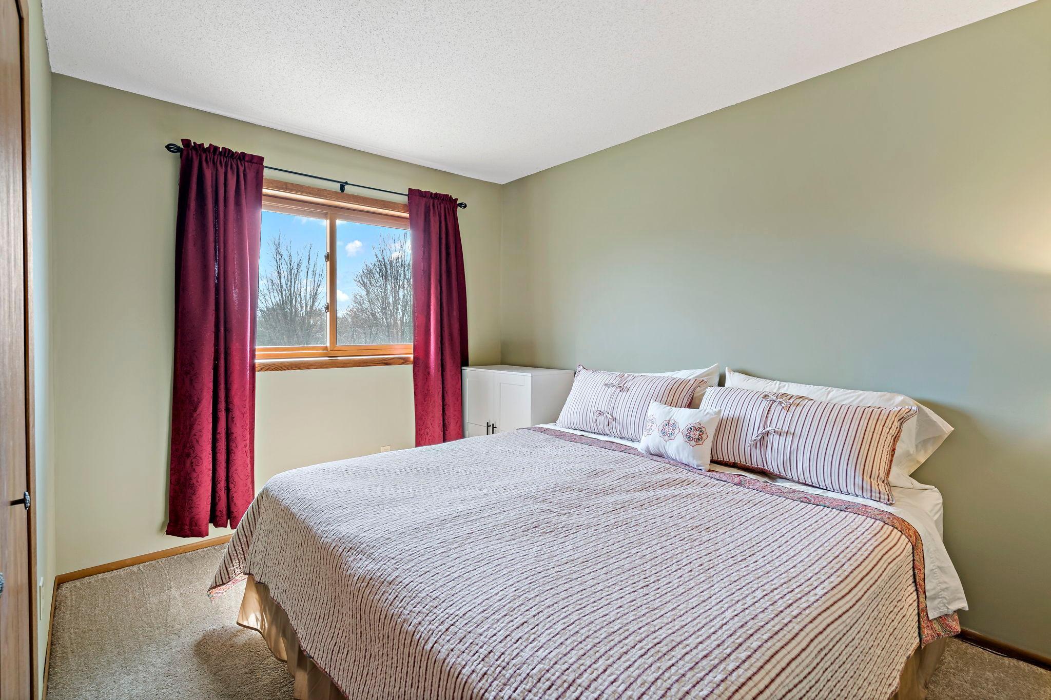 Spacious bedroom fits a king bed