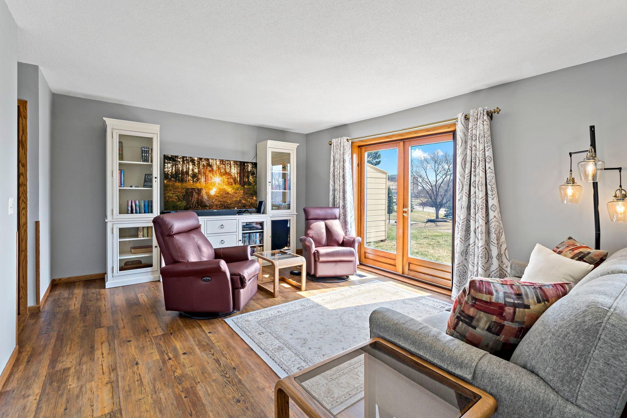 Warm inviting living room with view of backyard