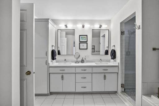 Bathroom features dual sinks and double vanity