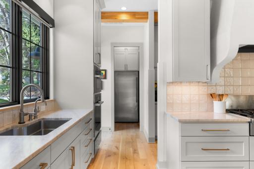 Pantry features Thermador freezer and ample shelf space