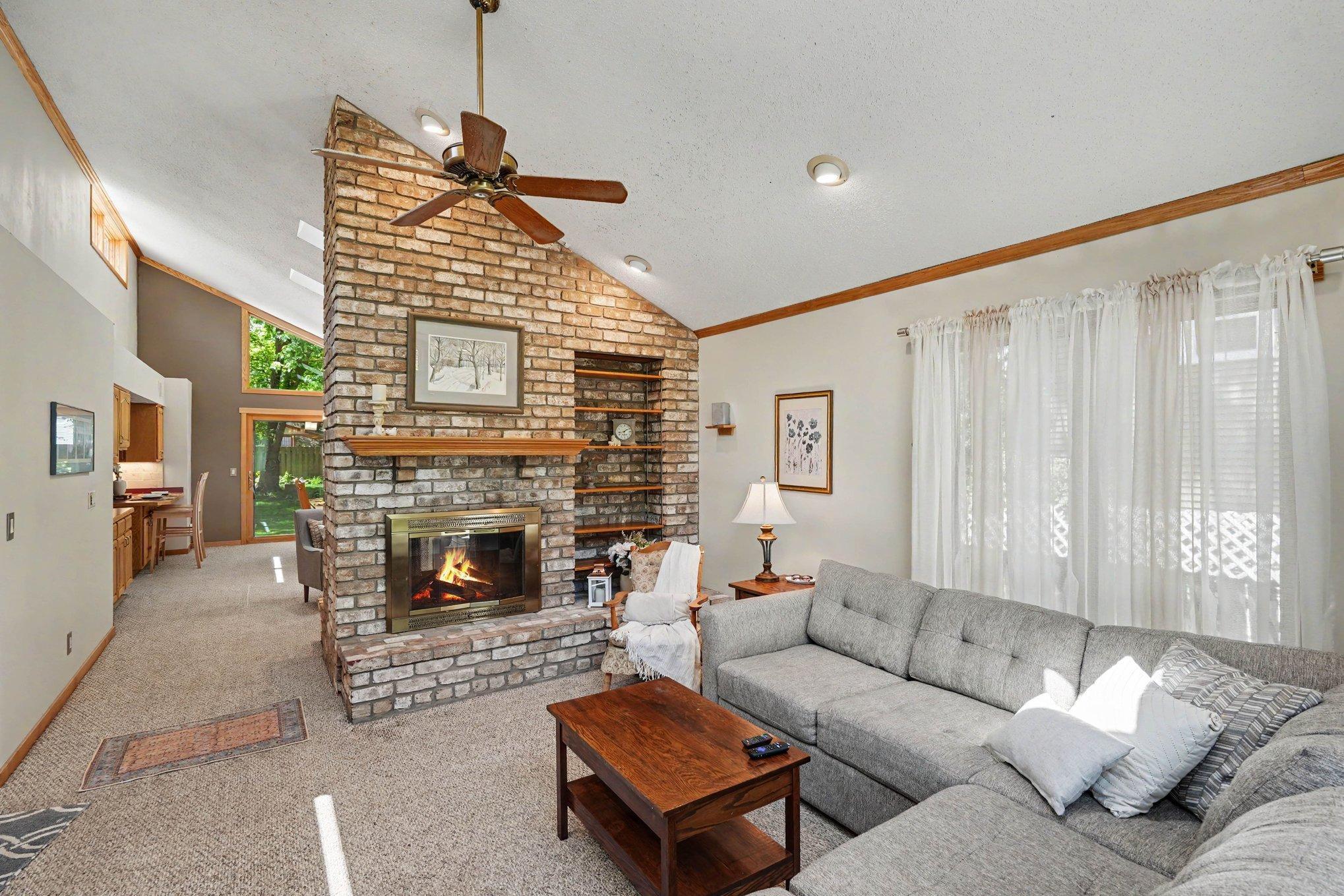 Brick fireplace with built-in shelving