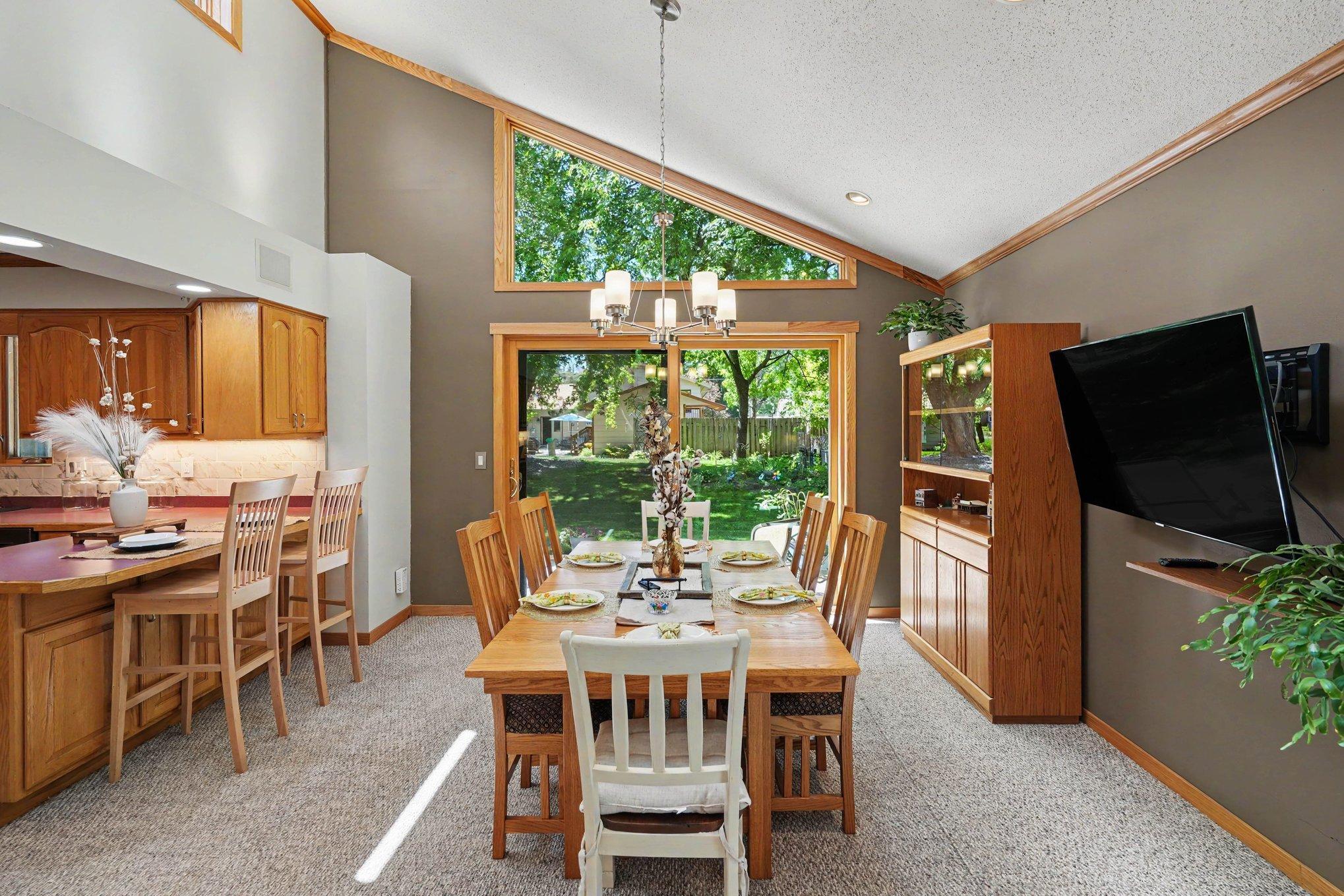 Dining room leads to patio and opens into kitchen