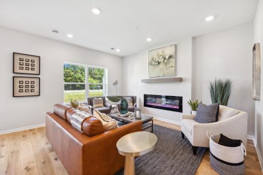 Living Room features electric fireplace - Picture of Model Home