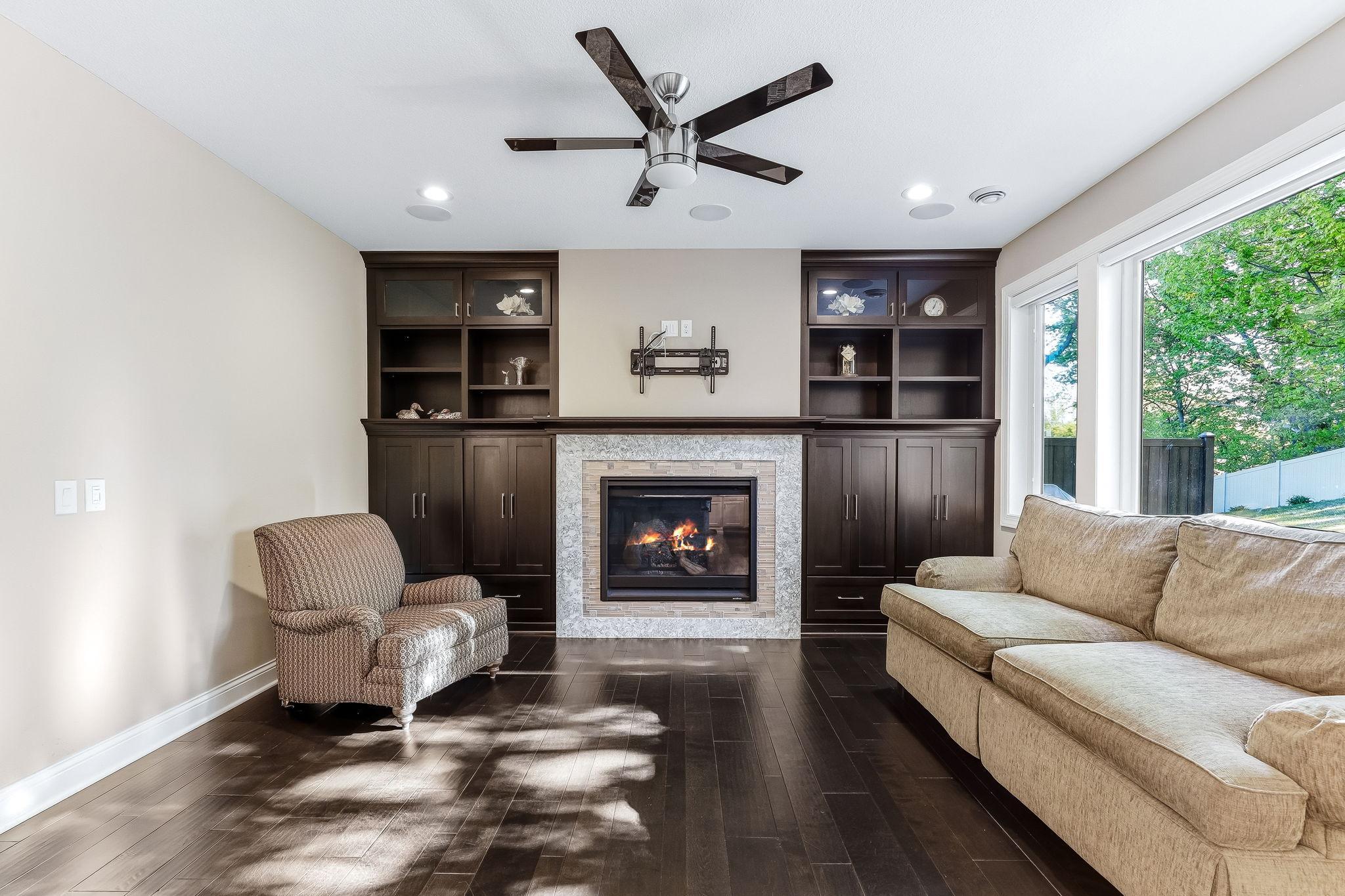 Living Room features natural light, a gas burning fireplace and built in entertainment center with space for a TV