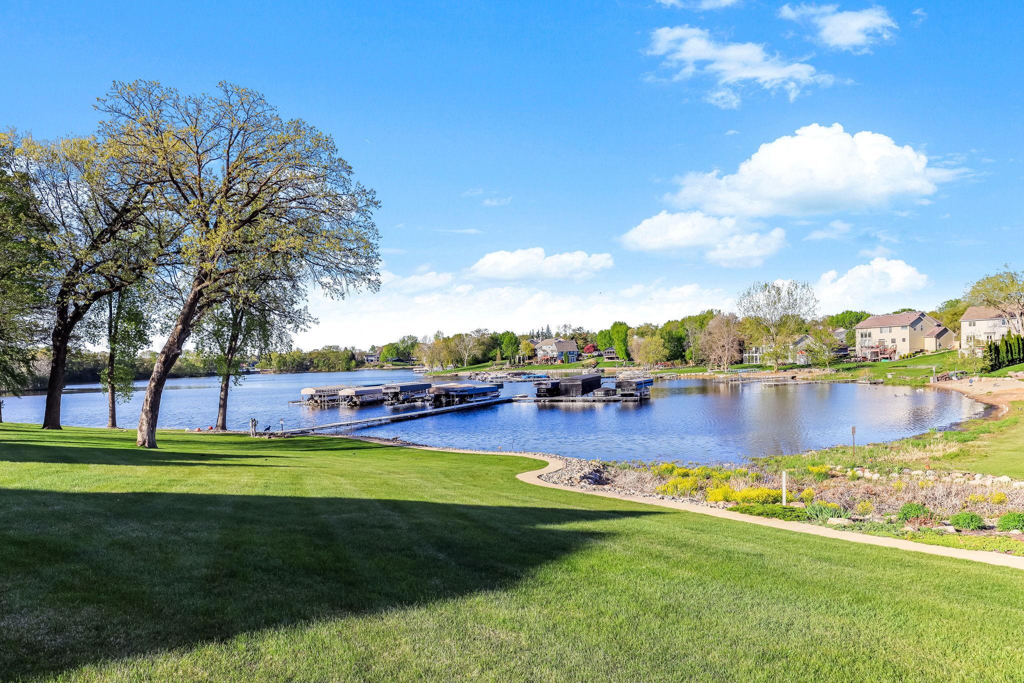 Extraordinary opportunity to own this custom designed detached townhome, featuring deeded lake access and designated boat slip on Upper Prior Lake.