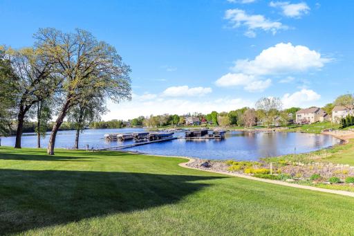 Extraordinary opportunity to own this custom designed detached townhome, featuring deeded lake access and designated boat slip on Upper Prior Lake.