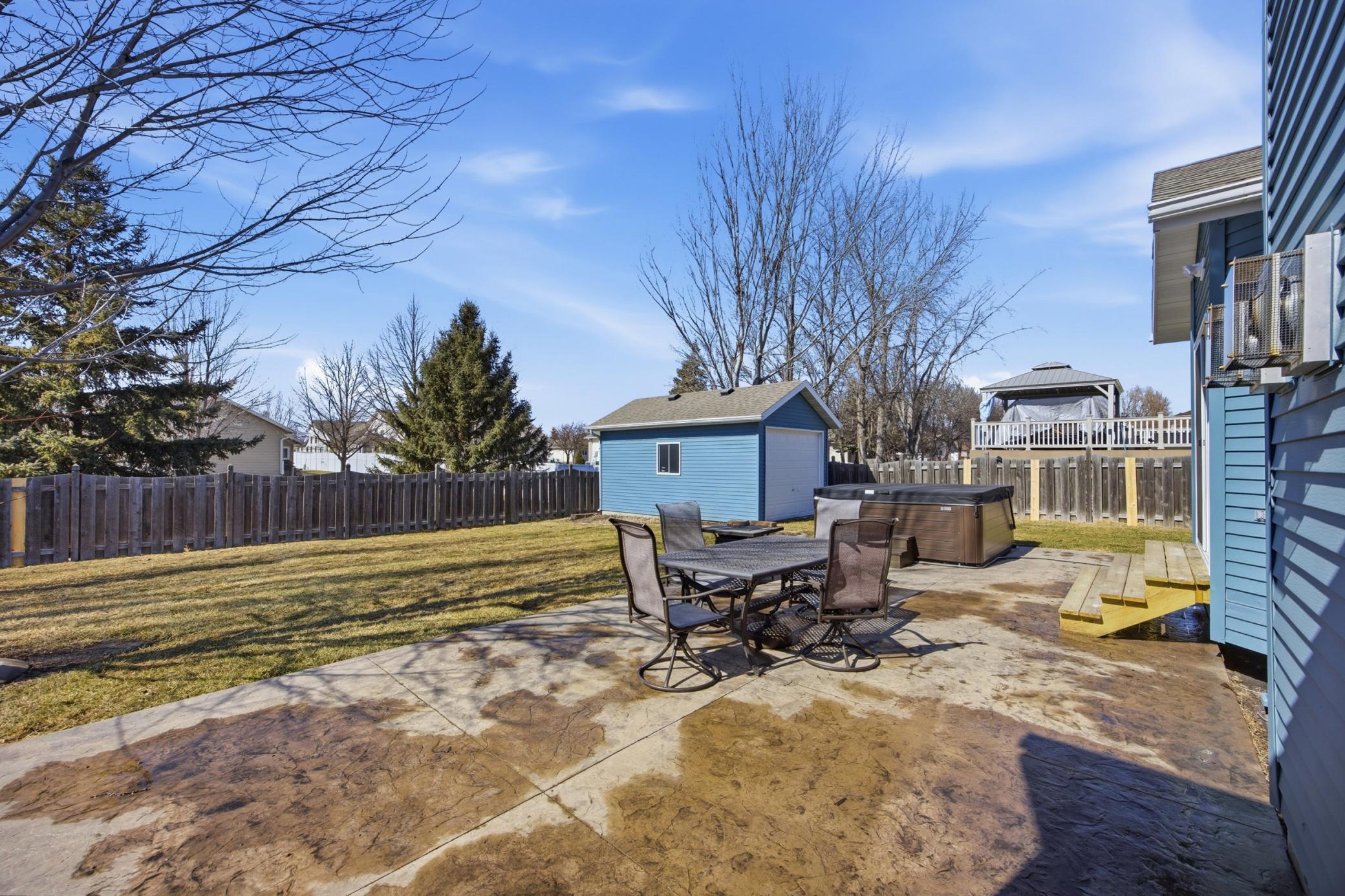Large Back Yard with Stamped Concrete Patio and Extra Large Shed