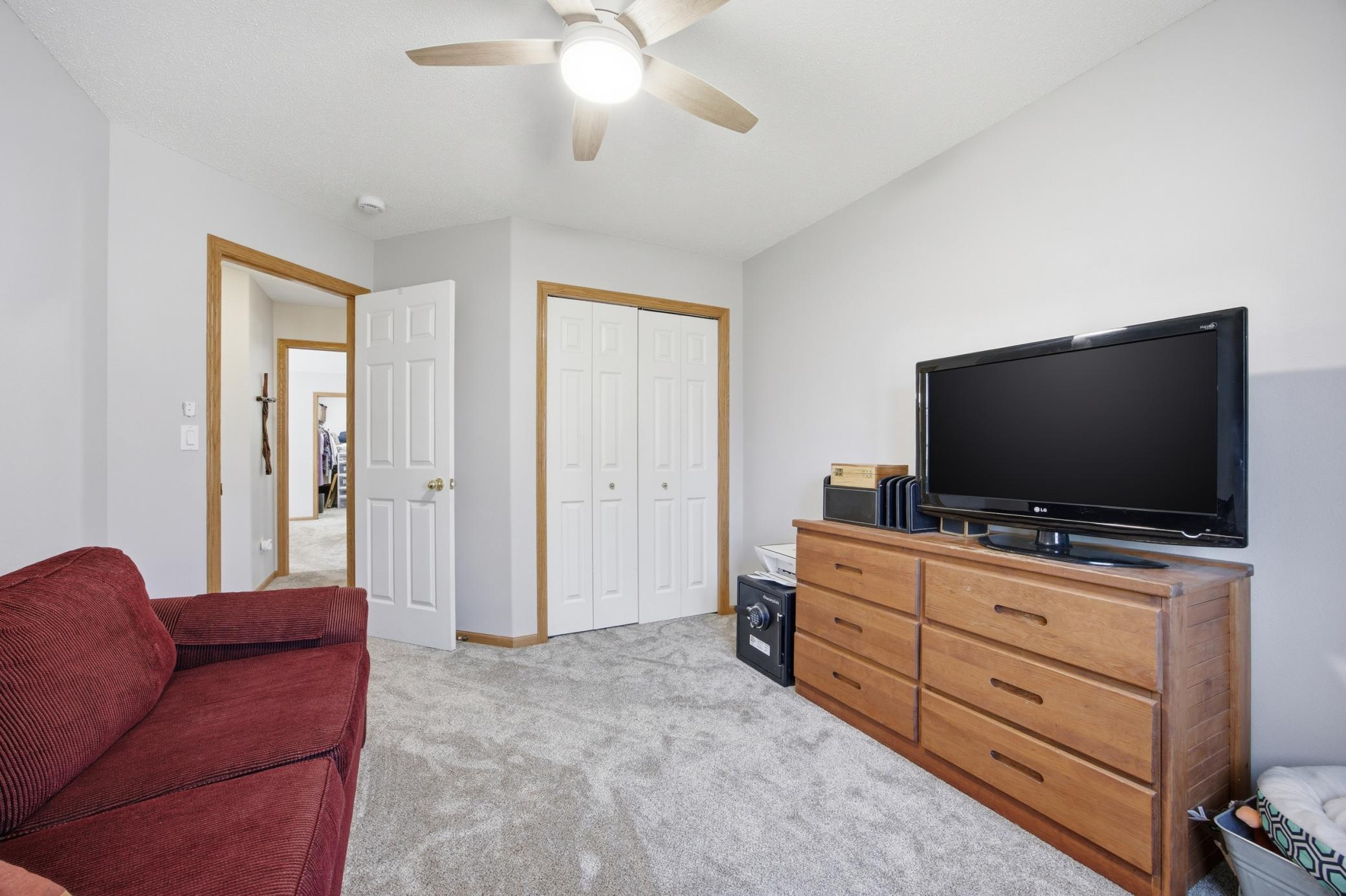 Upstairs Bedroom # 3 with new ceiling fan and carpet