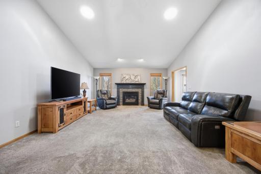 Living Room Featuring Gas Fireplace and 2 Tubular Skylights
