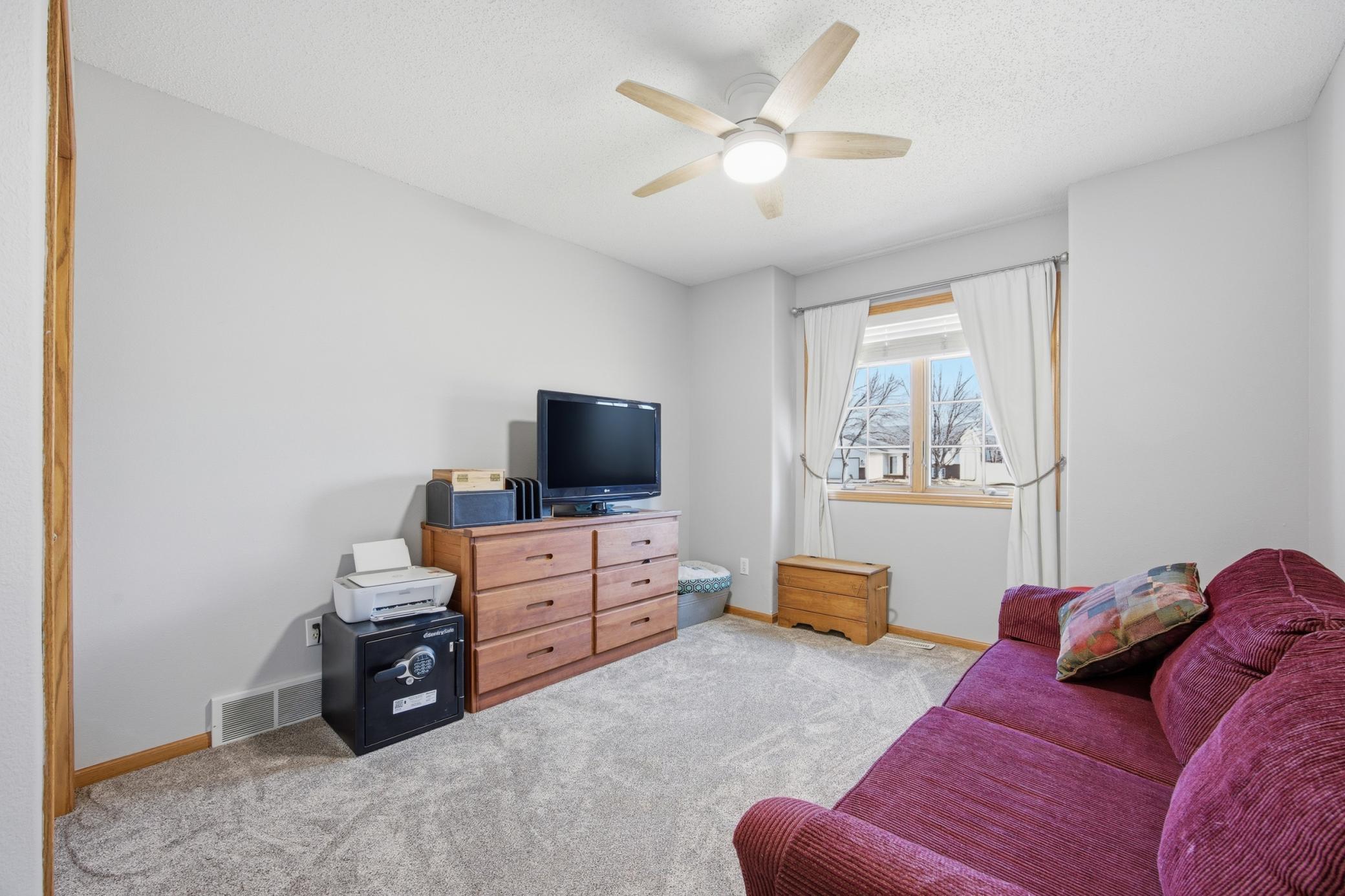 Upstairs Bedroom # 3 with new ceiling fan and carpet