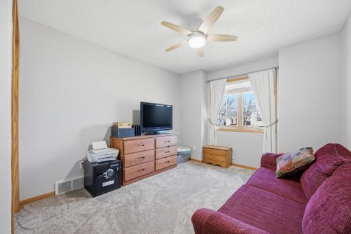 Upstairs Bedroom # 3 with new ceiling fan and carpet