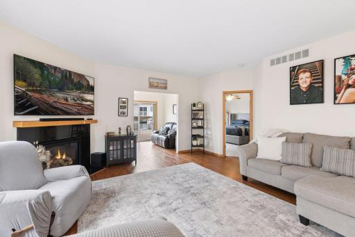 Living room into sunroom and into primary bedroom