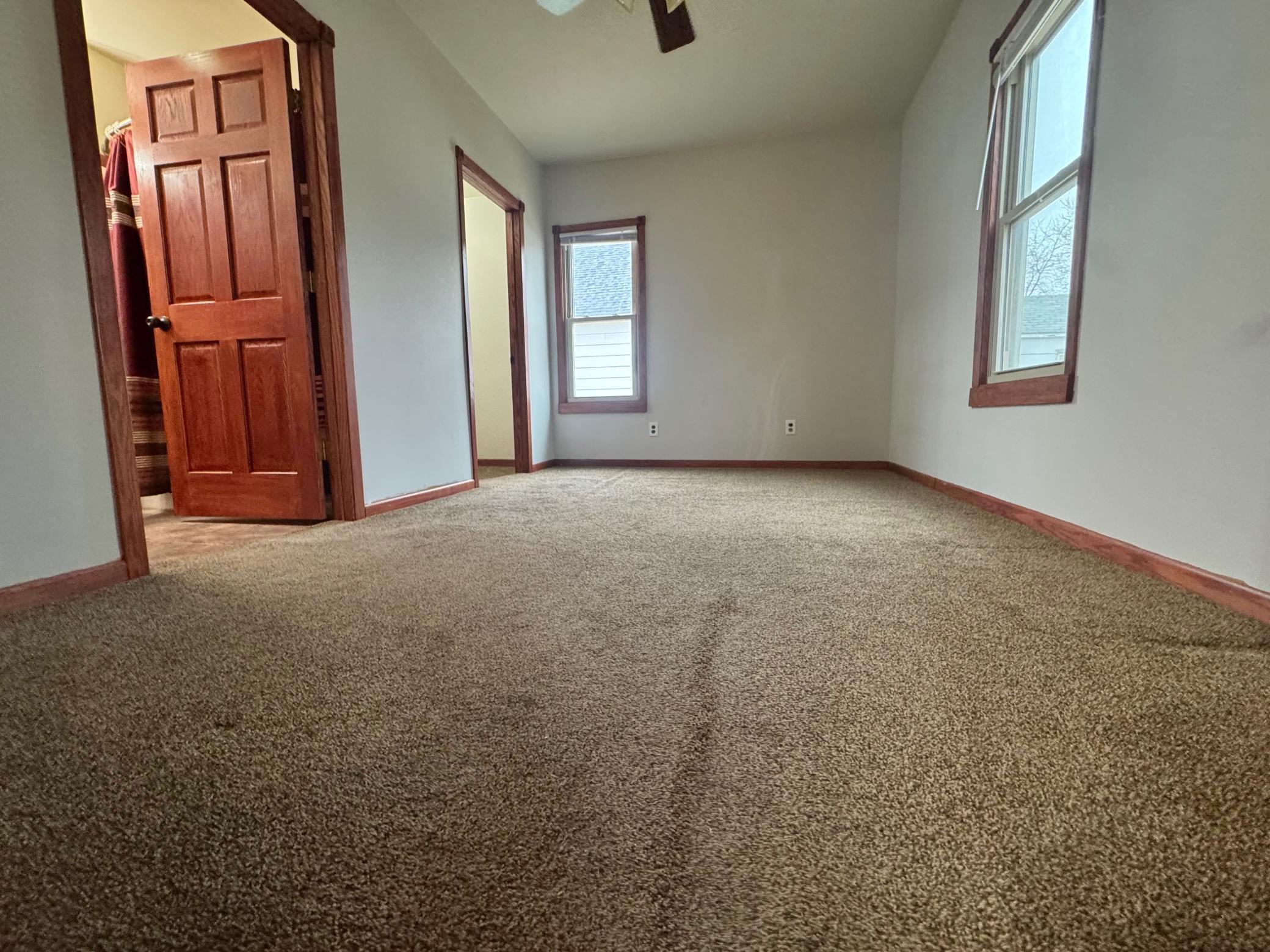 Main floor bedroom (walk-in closet & bath) or use as dining room