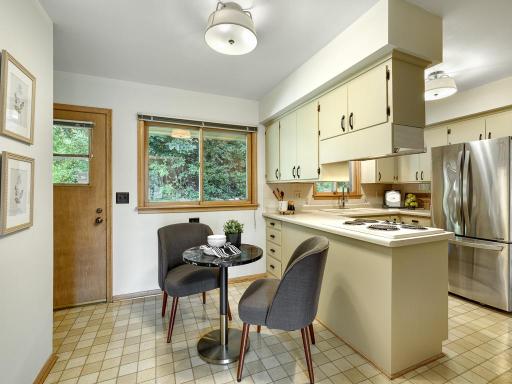 Charming informal dining area by the pantry.