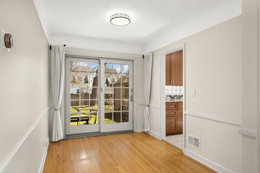 Great dining room has a sliding door flowing out the the backyard