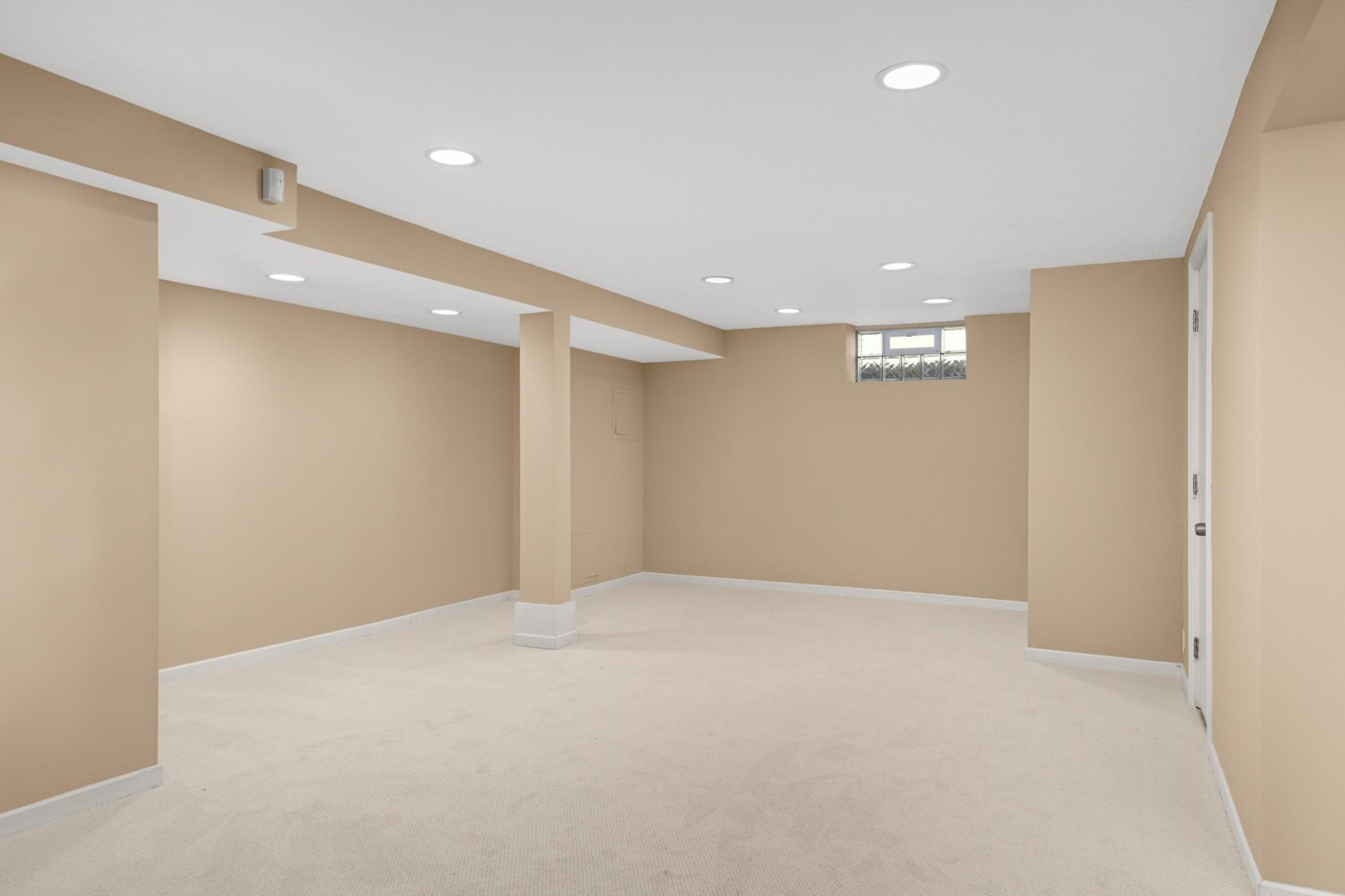 Extraordinary lower level Family room with good ceiling height and recessed lighting