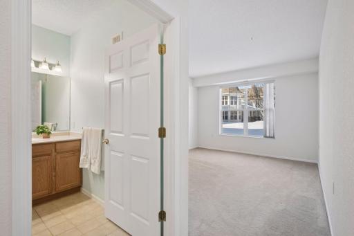 Primary bedroom with private bathroom and large closet