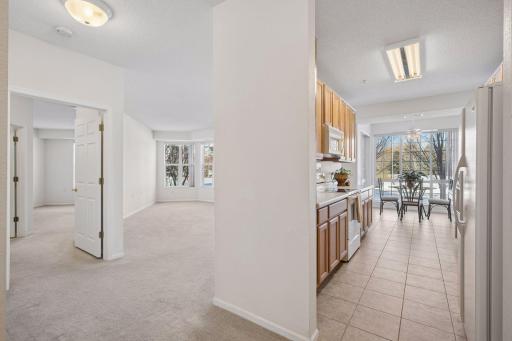 As you enter there is a coat closet to your right, the kitchen is straight ahead with the living/dining and primary bedroom off to your left. The secondary bedroom or den and 2nd bath and laundry room are off to the right.
