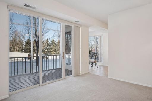 Living/dining room looks right into nook and screen porch