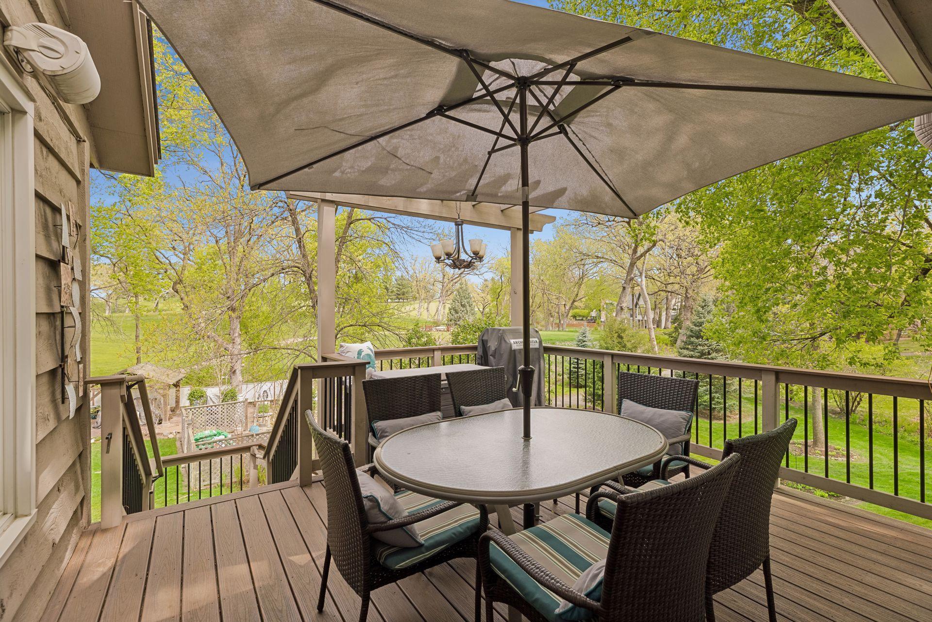 5718 Auto Club Circle Deck off Main Floor Sunroom.jpg