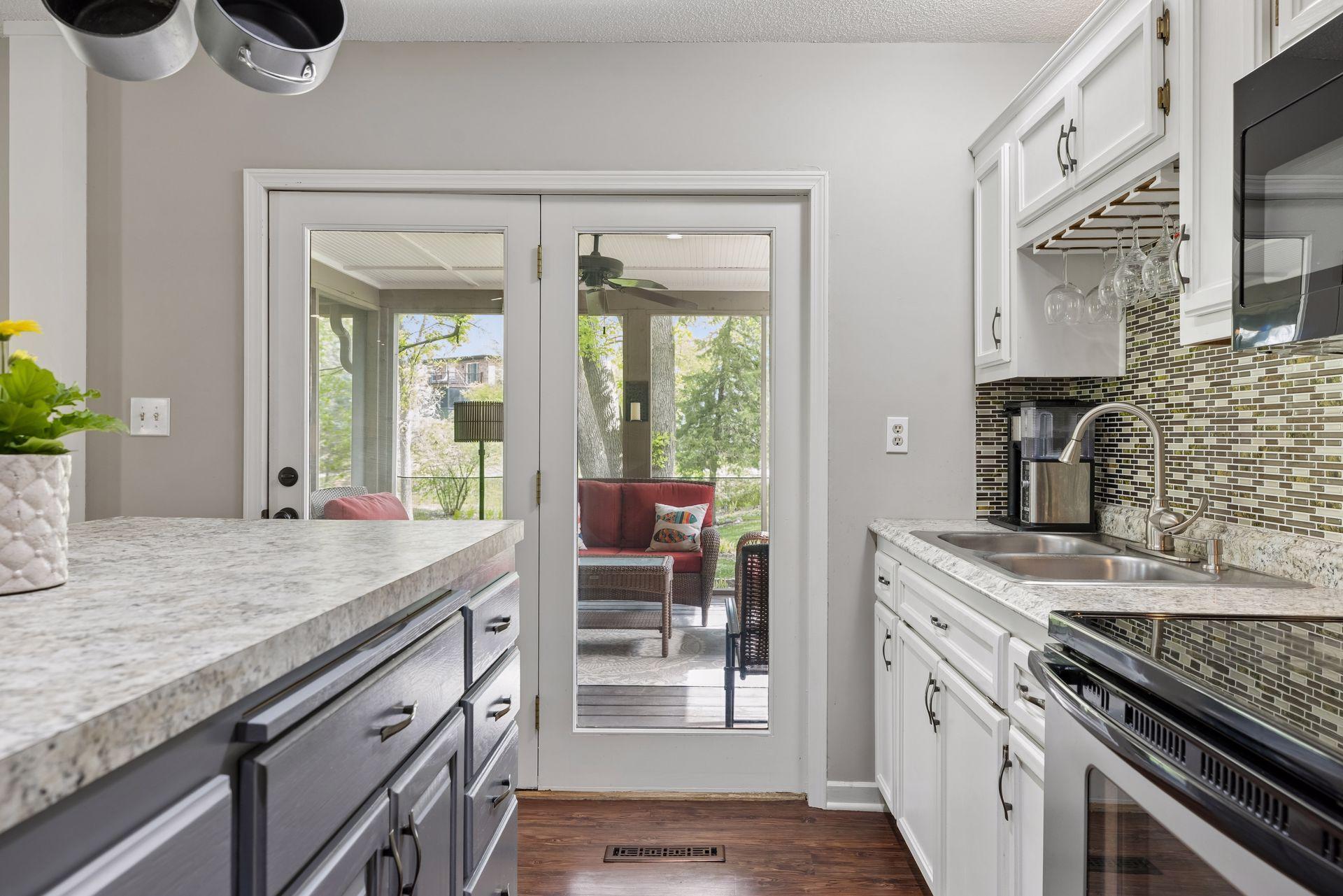 5718 Auto Club Circle 2nd Kitchen into Screen porch.jpg