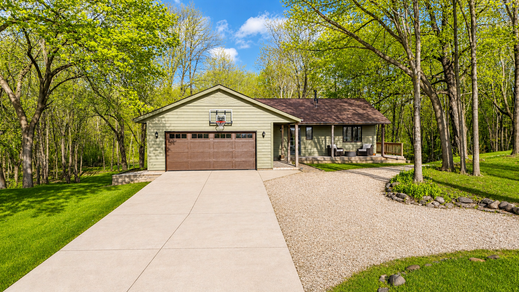 Front of home with additional gravel parking spots and driveway entrance to behind the home
