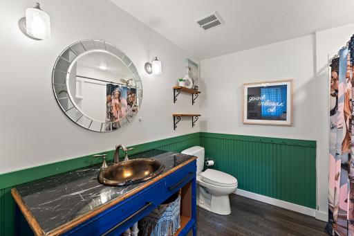 Lower-level bathroom 1. 3/4 bath with large shower. This one is attached to the back bedroom. Perfect for the teenager or guest!