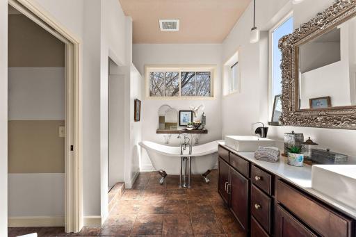 Spa-like primary ensuite with soaking tub and walk-in shower
