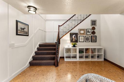 Bright and inviting finished lower level - features cork floors!