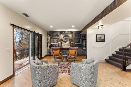 Cork flooring, large windows, and high ceilings give this space a light and airy feel