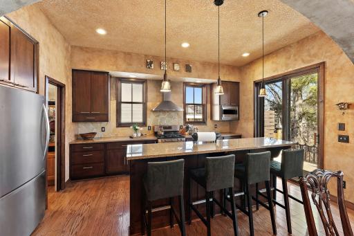 Kitchen has plenty of storage including a large walk-in pantry and quartz counters!