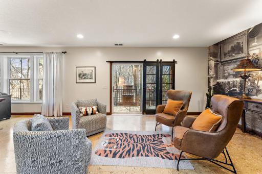 Walk-out to patio - this space could accommodate a pool table too!