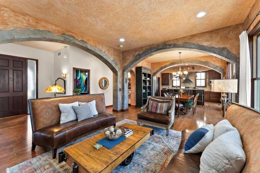Inviting and open main floor layout. Walls and ceiling are textured with a faux style paint.