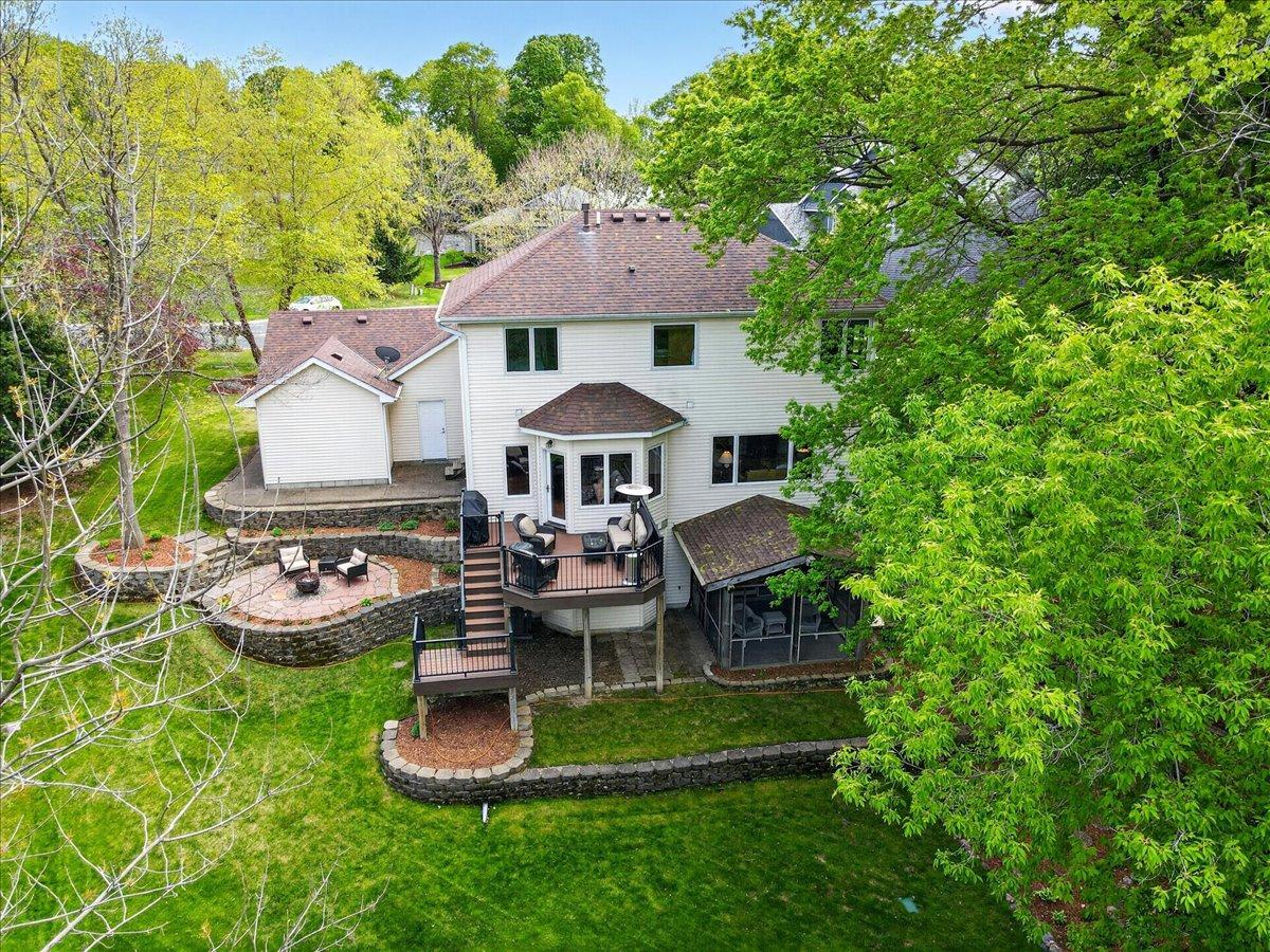 This home is siutated on an incredible, private & wooded .43 acre lot!