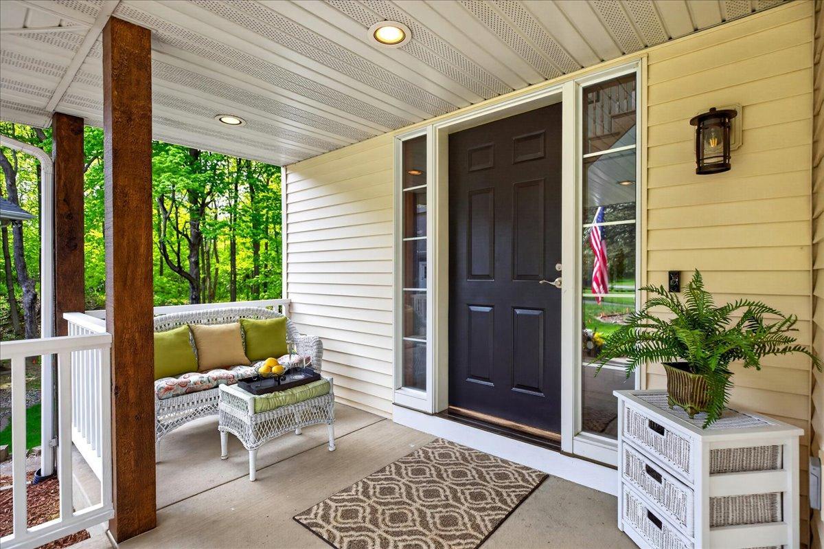Patio to left of front door is a perfect place to relax or greet your guests.