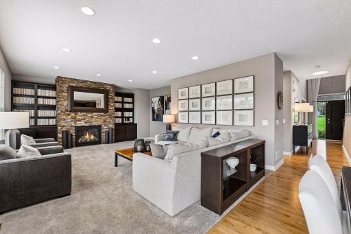 Family room with built ins surrounding fire place