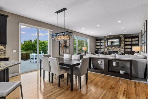 Informal dining space with statement fixture where you can step out to the deck.