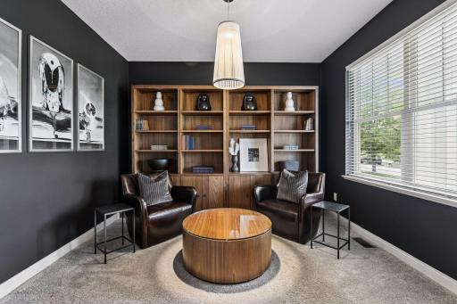 Warm modern front office as you enter the home to your right with French doors.