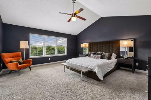 Owners bedroom with vaulted ceilings and views of the wetland preserve