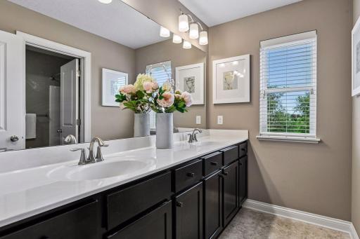 Upper level bath between the two bedrooms with separate water closet and shower