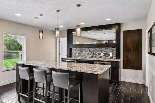 Lower level kitchen for entertaining with granite island