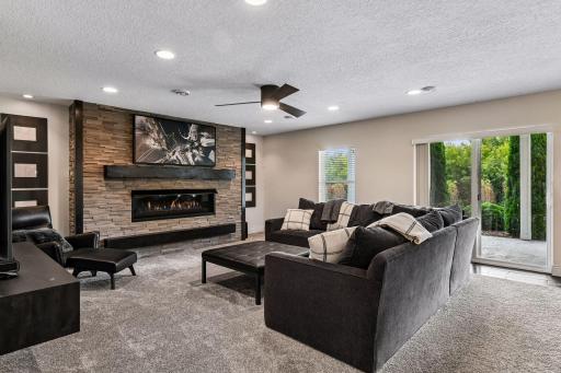 Lower level living room with 60 inch linear gas fireplace