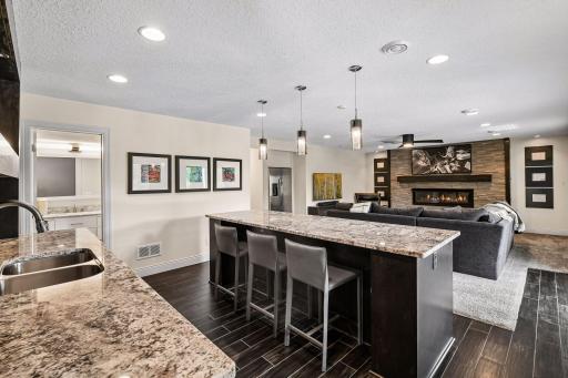 Lower level island with seating for 6+ and full refrigerator